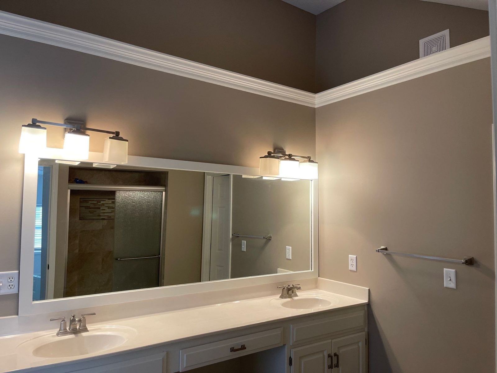 Custom bathroom remodel with double vanity by Uprise Remodeling